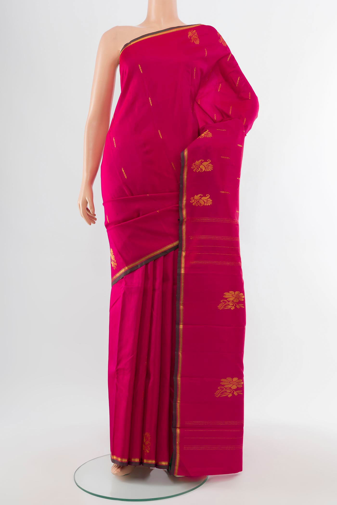 Pure Silk Pure Zari Dark Pink Kanjivaram Saree with Zari Butta on the body and Silk Border.  displayed on a mannequin