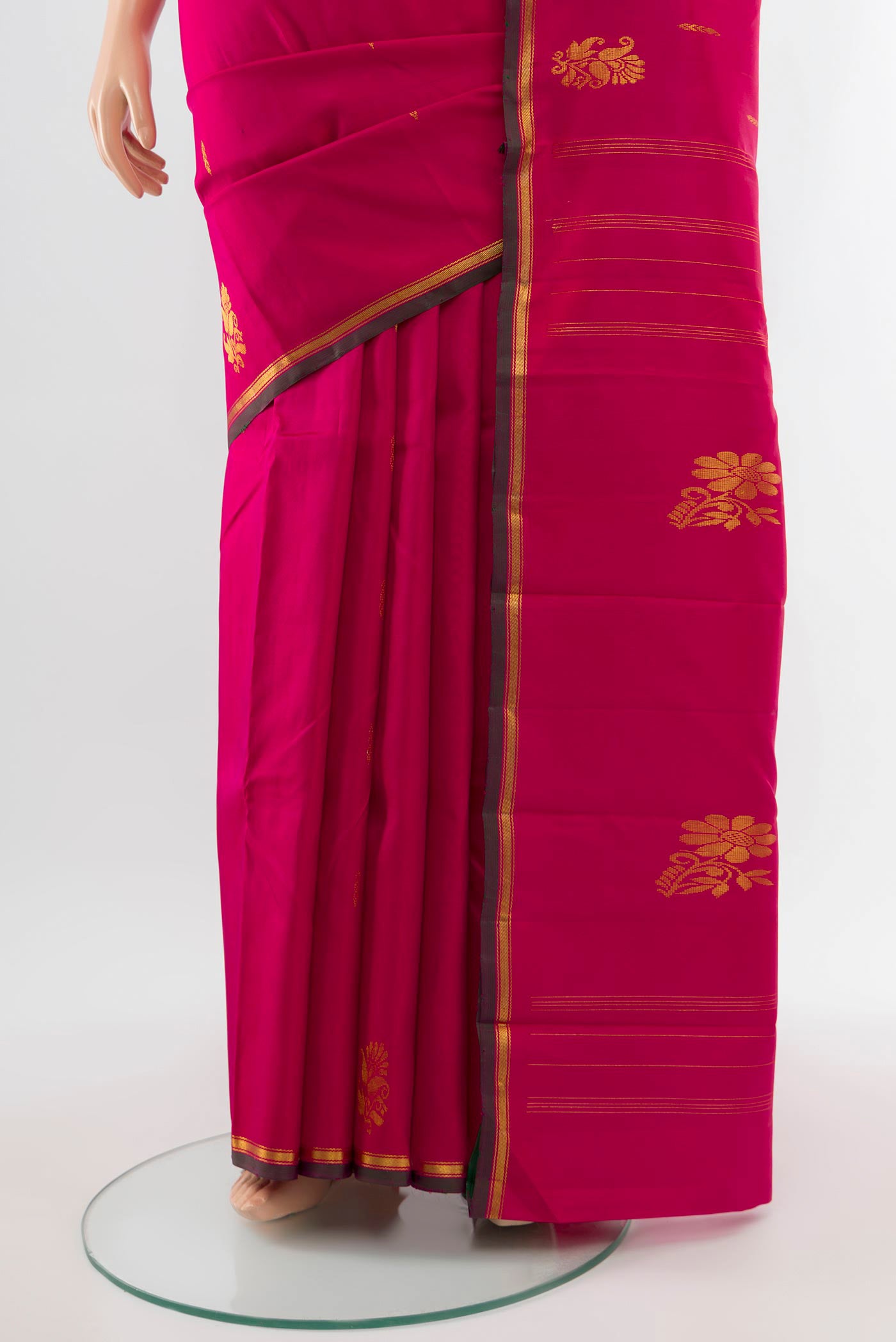Pleats and pallu of Pure Silk Pure Zari Dark Pink Kanjivaram Saree with Zari Butta on the body and Silk Border. 