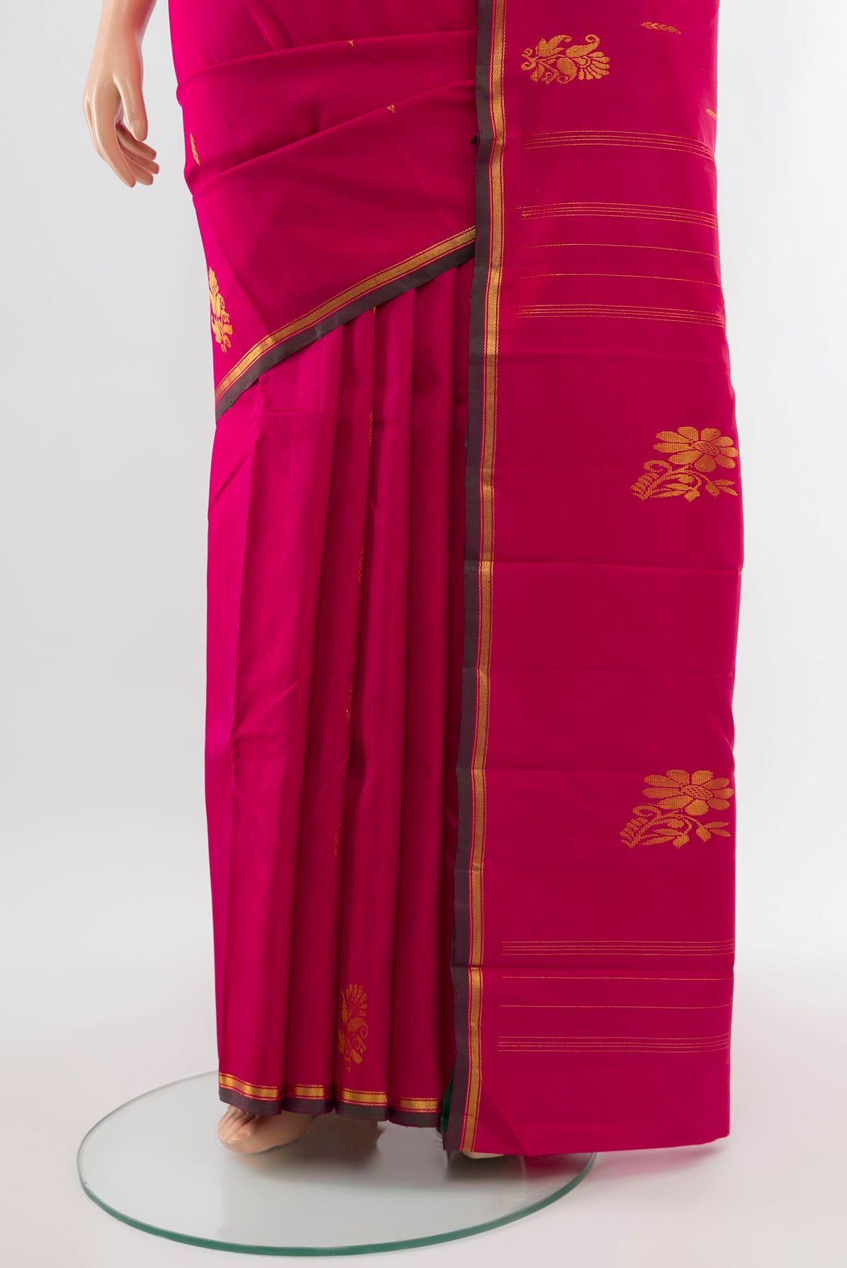 Pleats and pallu of Pure Silk Pure Zari Dark Pink Kanjivaram Saree with Zari Butta on the body and Silk Border. 