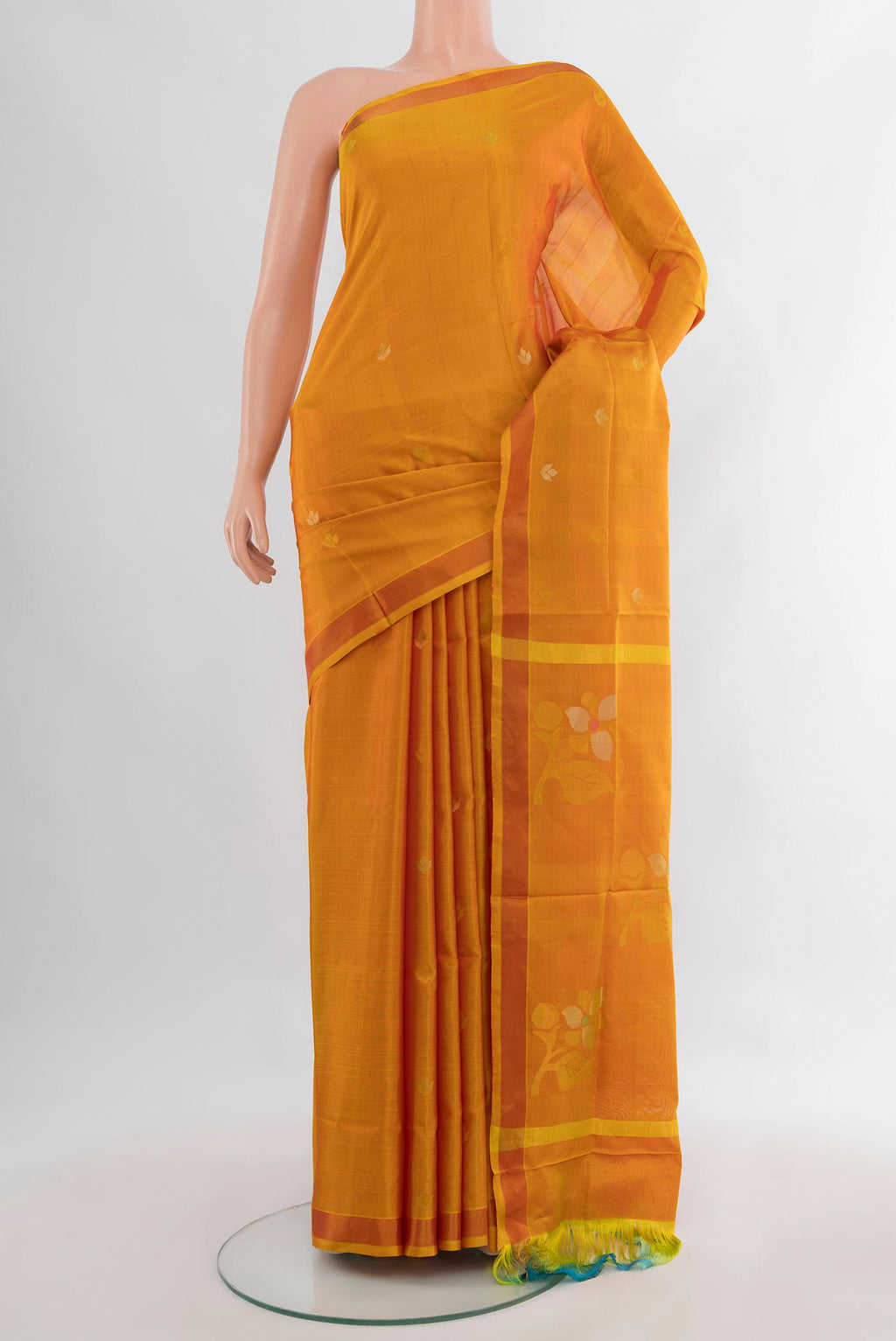 Pure Silk Mustard Uppada Saree with Zari Butta on the body and Zari Border.  displayed on a mannequin