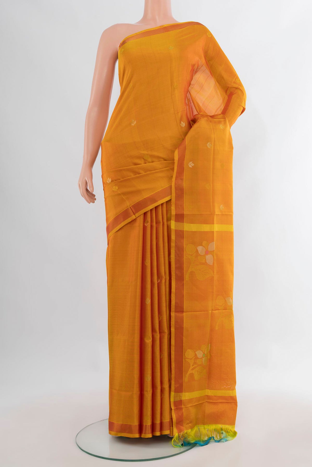 Pure Silk Mustard Uppada Saree with Zari Butta on the body and Zari Border.  displayed on a mannequin