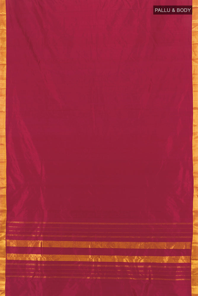 Flat view of Maroon Kanjivaram Silk Saree with Zari Butta on the body and Silk Border. 