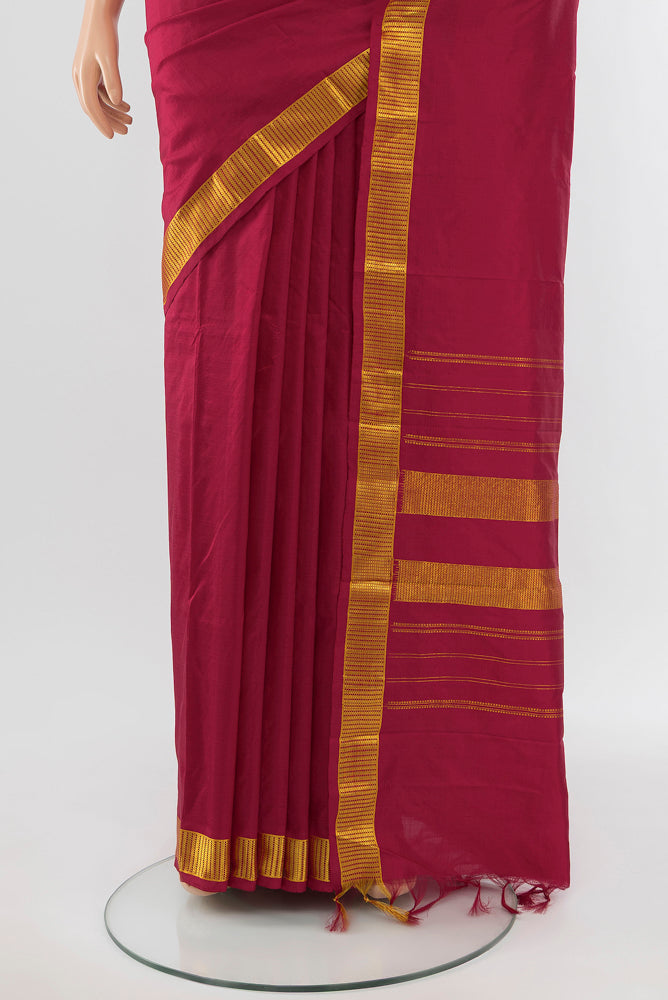Pleats and pallu of Maroon Kanjivaram Silk Saree with Zari Butta on the body and Silk Border. 