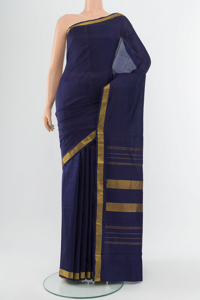 Navy Blue Kanjivaram Silk Saree with Zari Butta on the body and Silk Border.  displayed on a mannequin