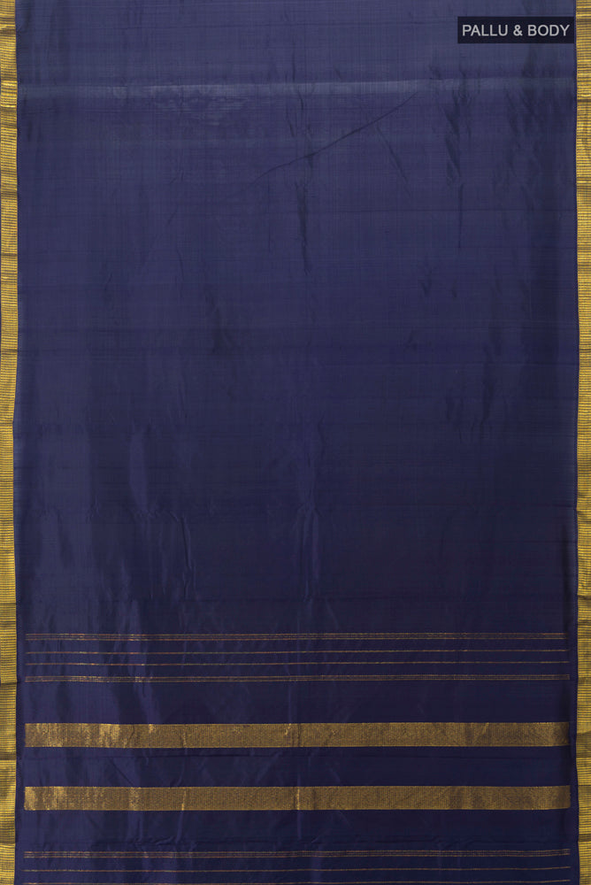 Flat view of Navy Blue Kanjivaram Silk Saree with Zari Butta on the body and Silk Border. 
