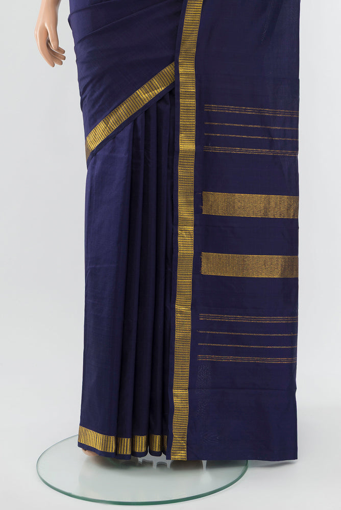 Pleats and pallu of Navy Blue Kanjivaram Silk Saree with Zari Butta on the body and Silk Border. 