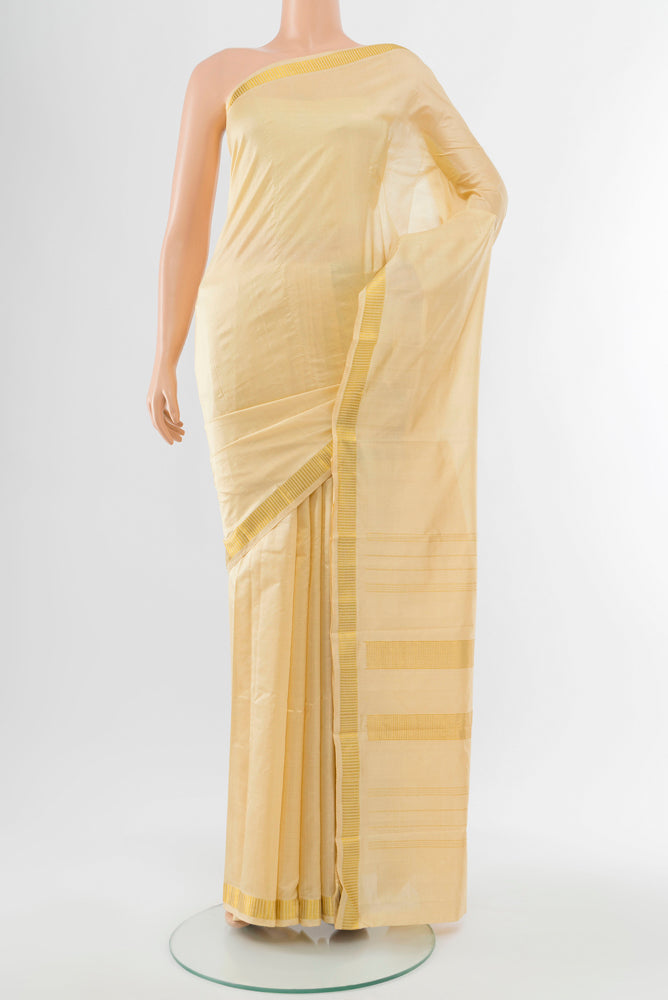 Cream Kanjivaram Silk Saree with Plain Body and Silk Border.  displayed on a mannequin