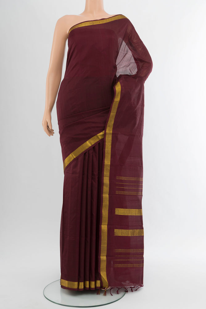 Pure Silk Pure Zari Coffee Brown Kanjivaram Saree with Zari Butta on the body and Silk Border.  displayed on a mannequin