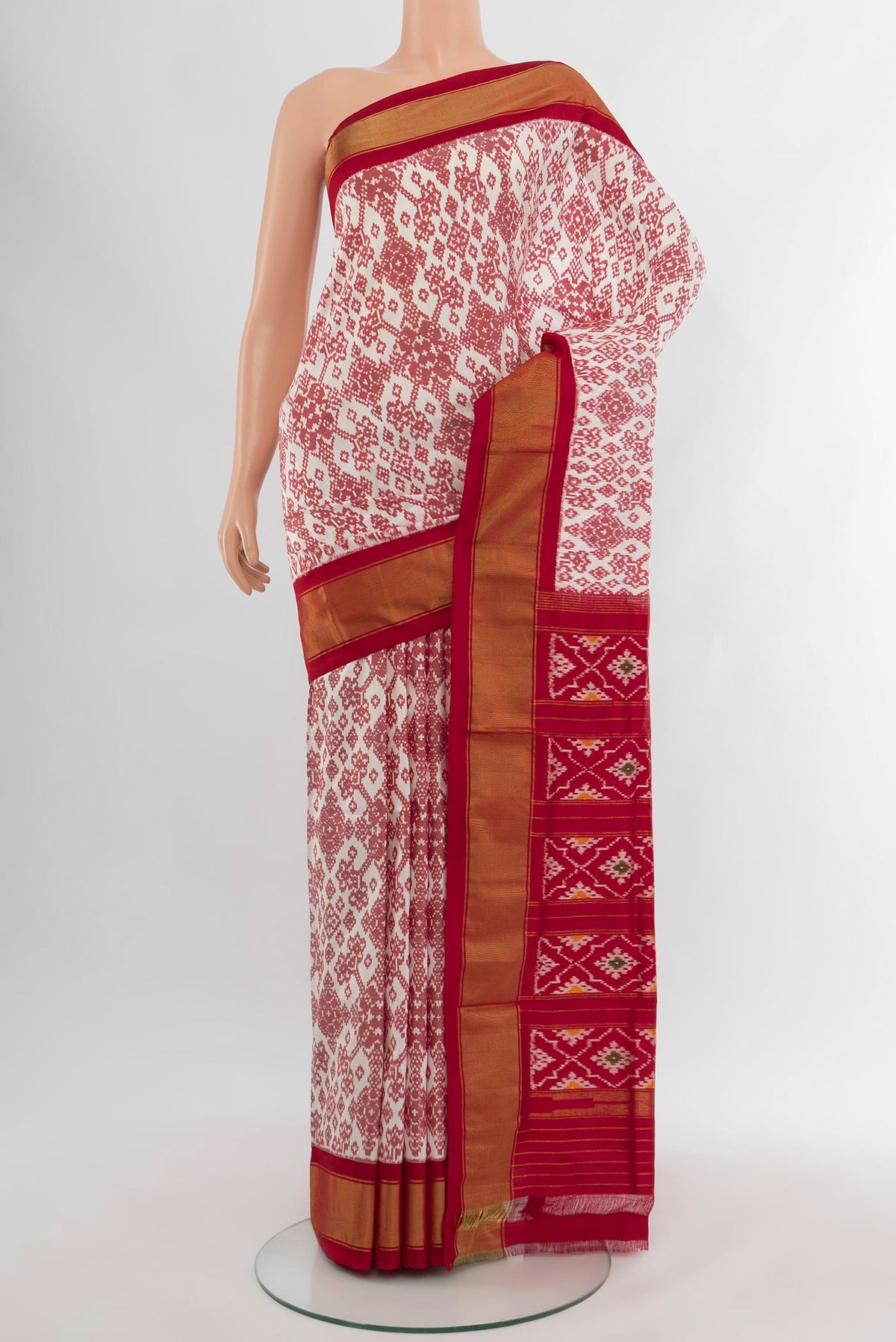 Off White Pochampally Silk Saree with Pure Ikat on the body and Zari Border.  displayed on a mannequin