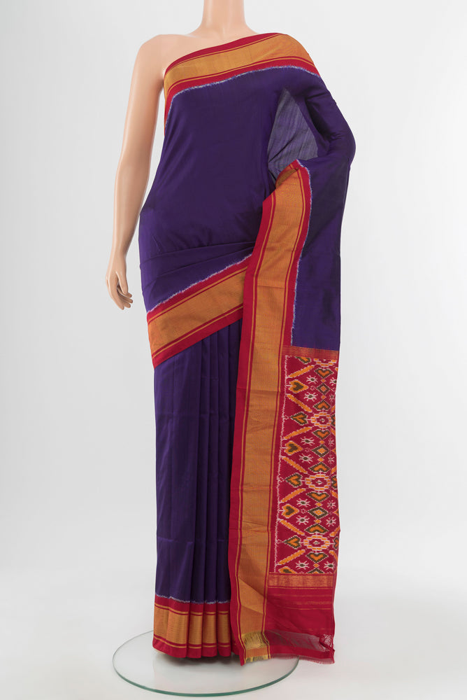 Dark Blue Pochampally Saree with Ikat Print on the body and Silk Border.  displayed on a mannequin