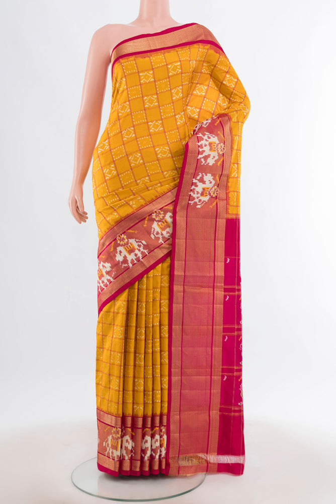 Yellow Pochampally Saree with Ikat Print on the body and Silk Border.  displayed on a mannequin