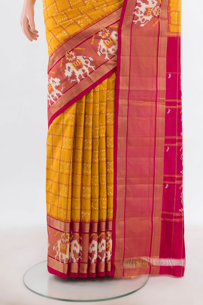 Pleats and pallu of Yellow Pochampally Saree with Ikat Print on the body and Silk Border. 