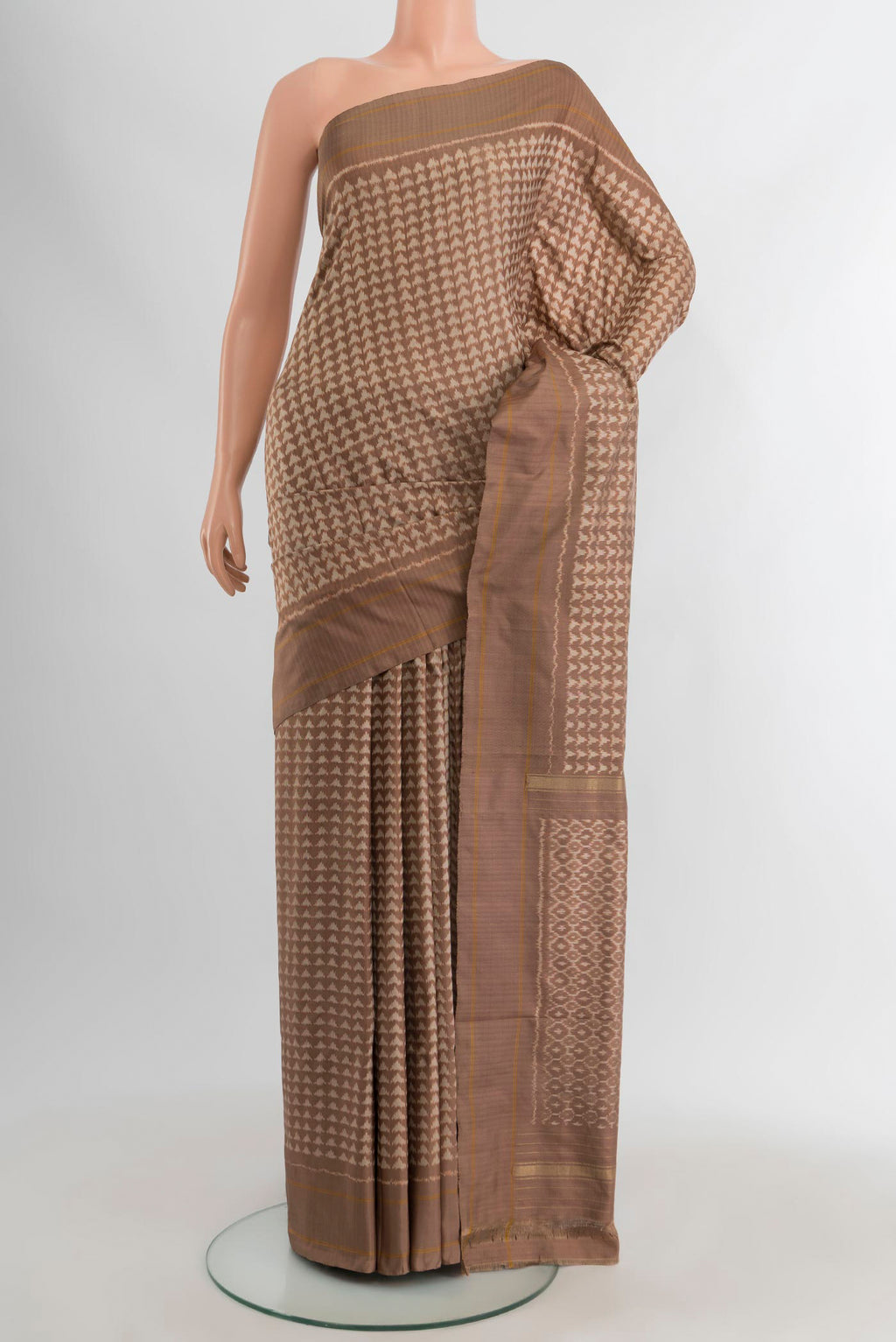 Brown Pochampally Silk Saree with Ikat design on the body and Plain Border.  displayed on a mannequin