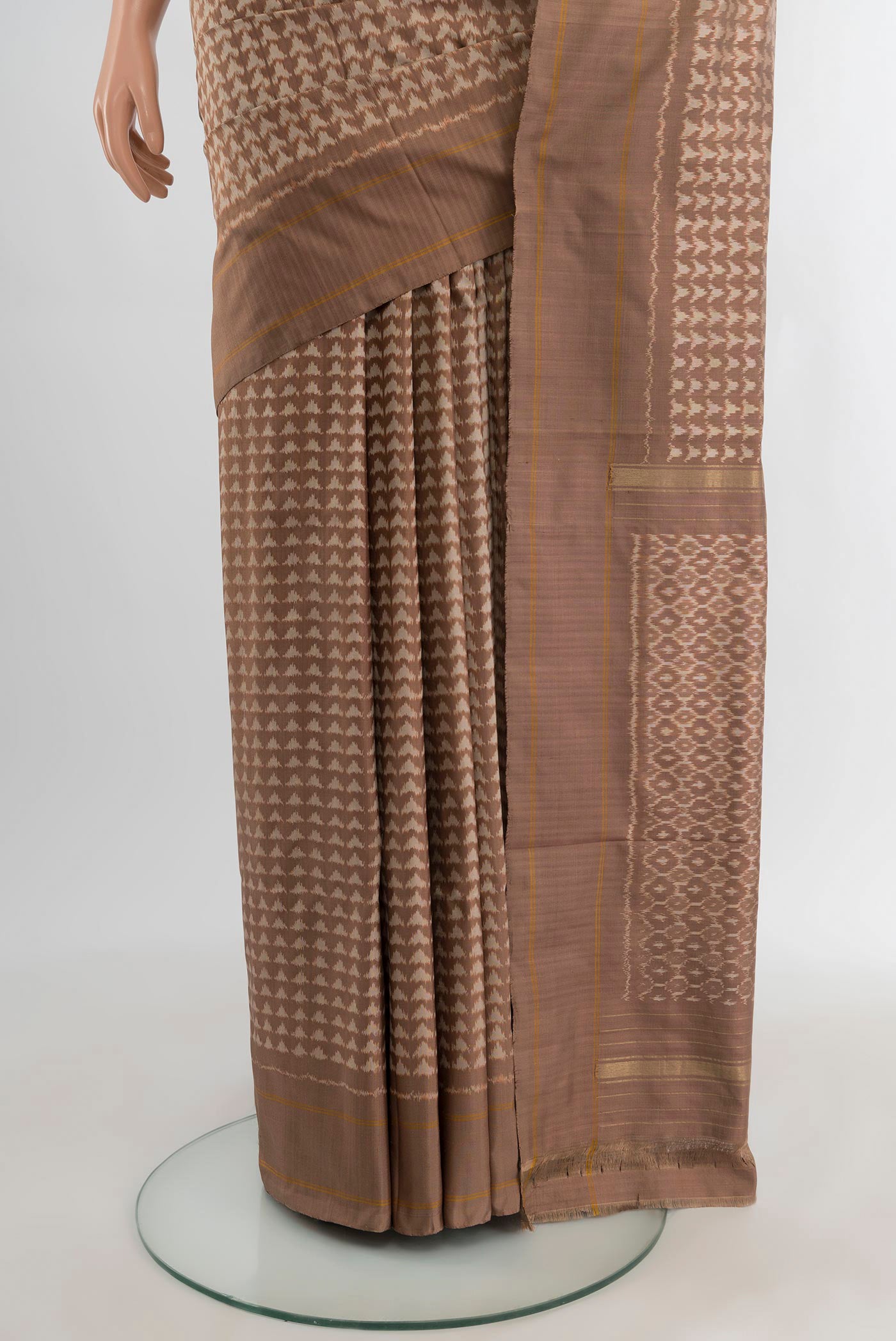 Pleats and pallu of Brown Pochampally Silk Saree with Ikat design on the body and Plain Border. 