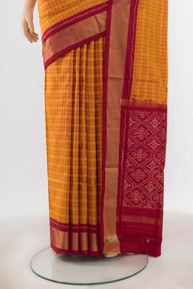 Pleats and pallu of Mustard Pochampally Saree with Ikat Print on the body and Silk Border. 