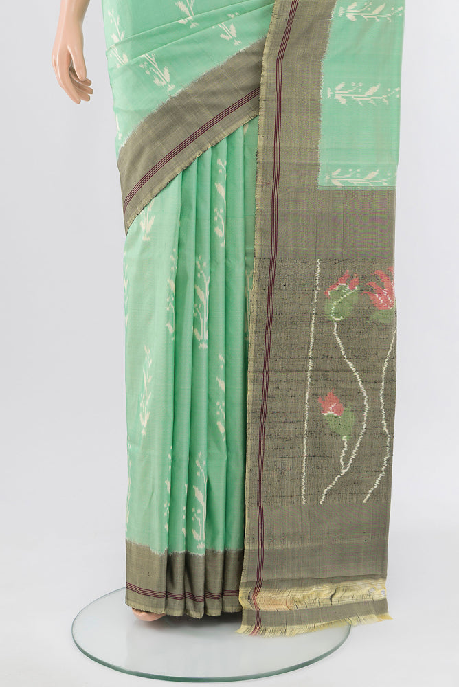 Pleats and pallu of Pista Green Pochampally Saree with Ikat Print on the body and Silk Border. 