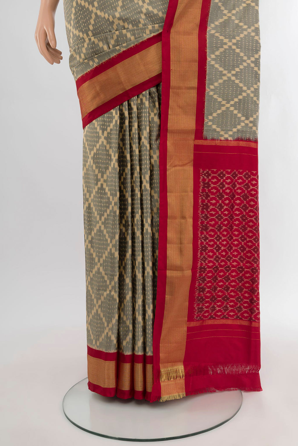Pleats and pallu of Grey Pochampally Silk Saree with Ikat design on the body and Zari Border. 