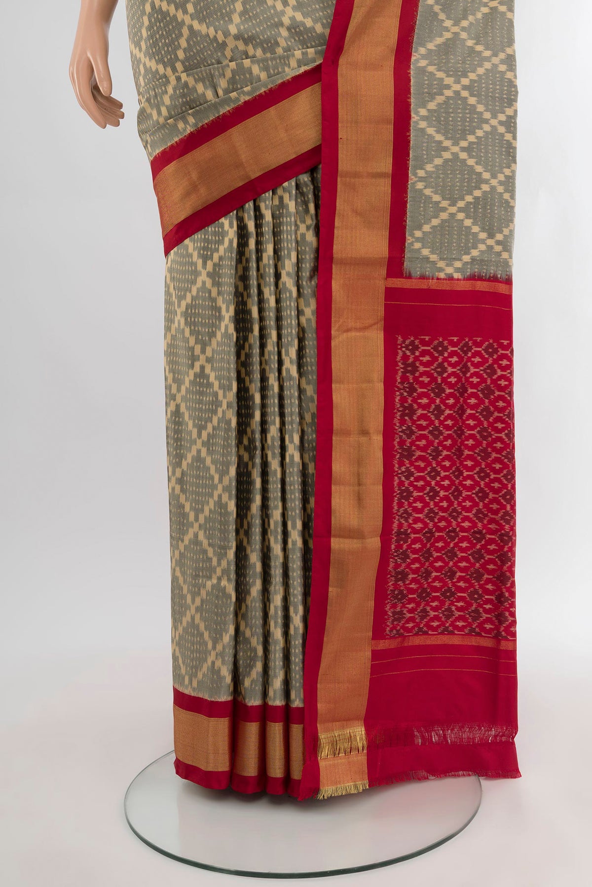 Pleats and pallu of Grey Pochampally Silk Saree with Ikat design on the body and Zari Border. 