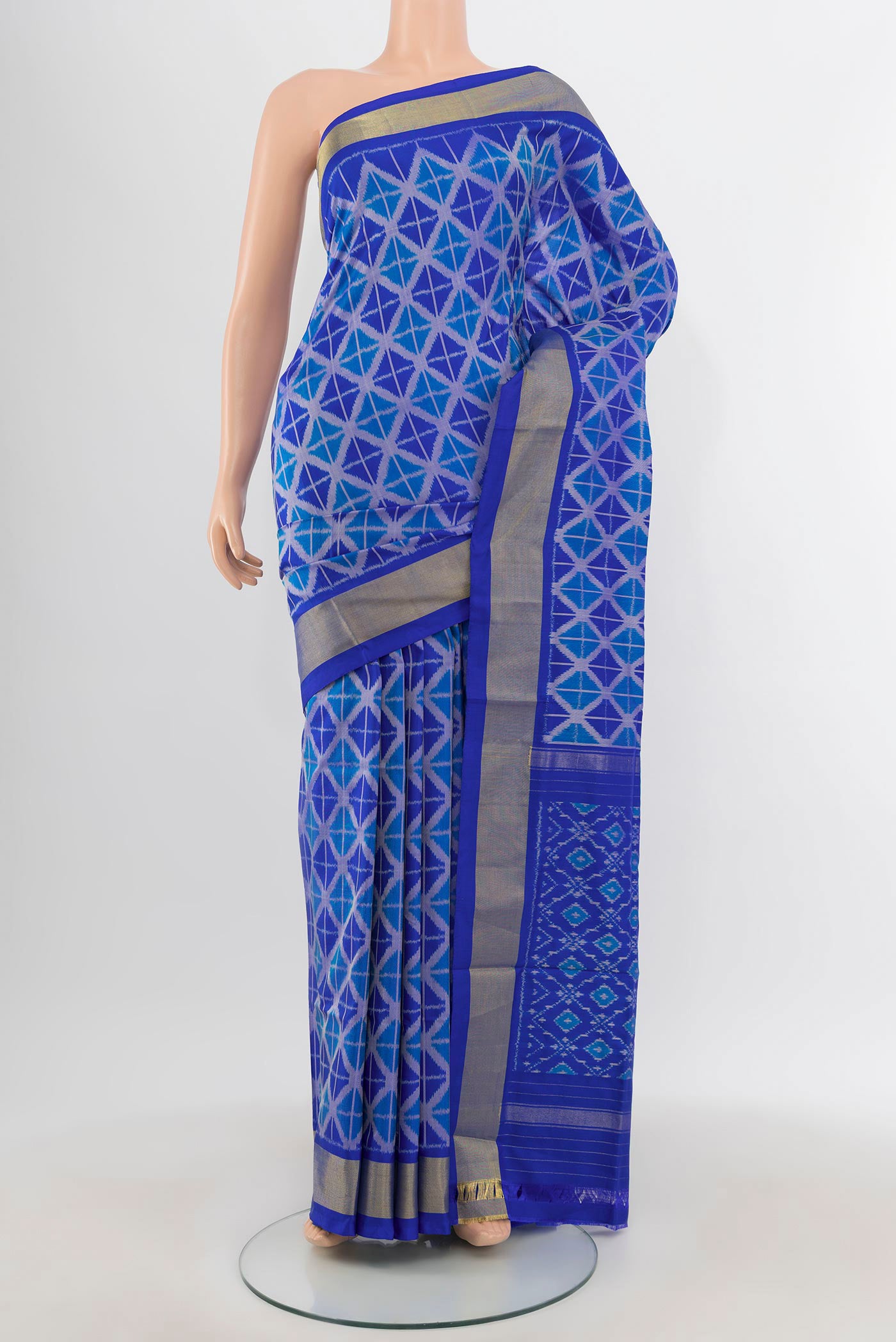 Royal Blue Pochampally Silk Saree with Pure Ikat on the body and Zari Border.  displayed on a mannequin