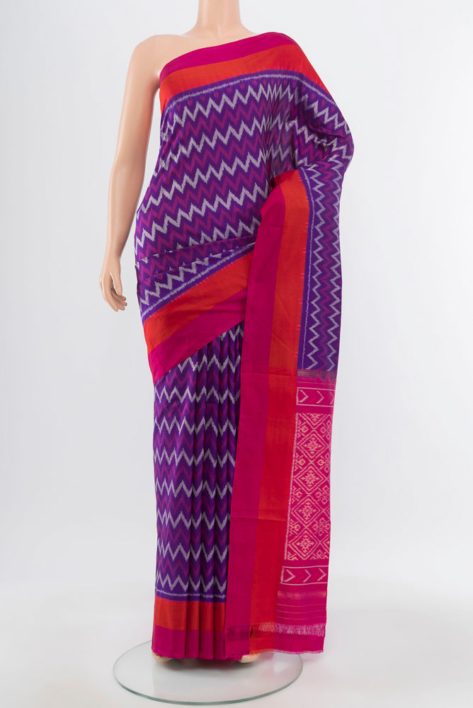 Pure Silk Pure Zari Dark Blue Pochampally Saree with Ikat Print on the body and Silk Border.  displayed on a mannequin