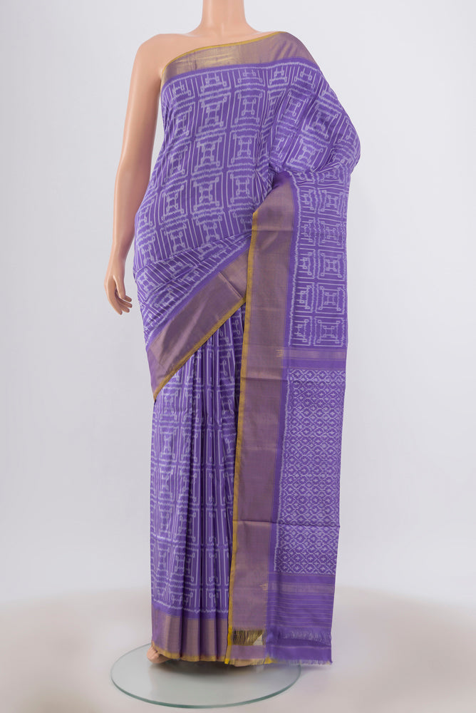 Lavender Pochampally Saree with Ikat Print on the body and Silk Border.  displayed on a mannequin