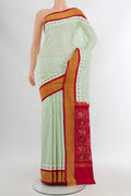 Cream Pochampally Silk Saree with Ikat Print on the body and Silk Border.  displayed on a mannequin