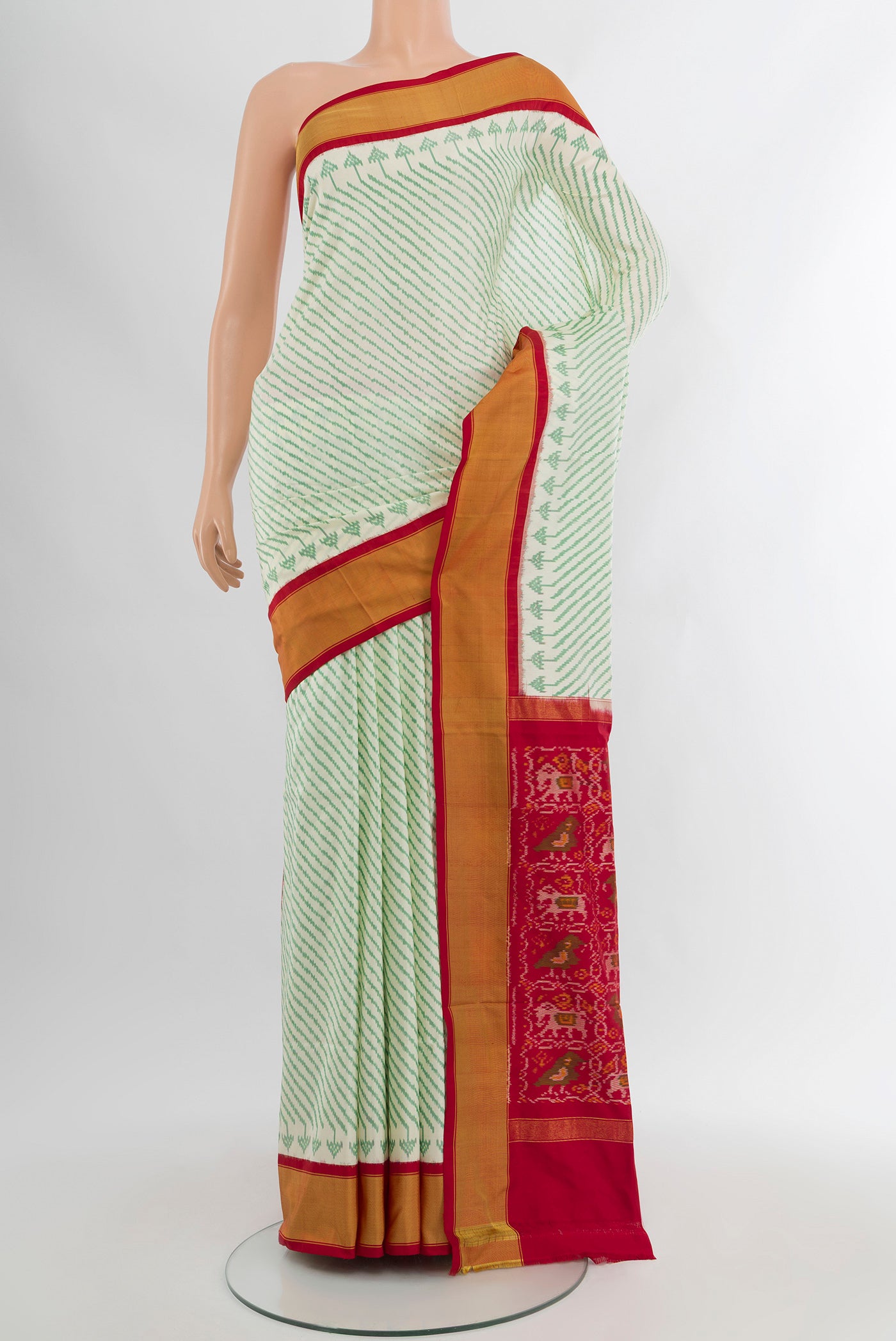 Cream Pochampally Silk Saree with Ikat Print on the body and Silk Border.  displayed on a mannequin