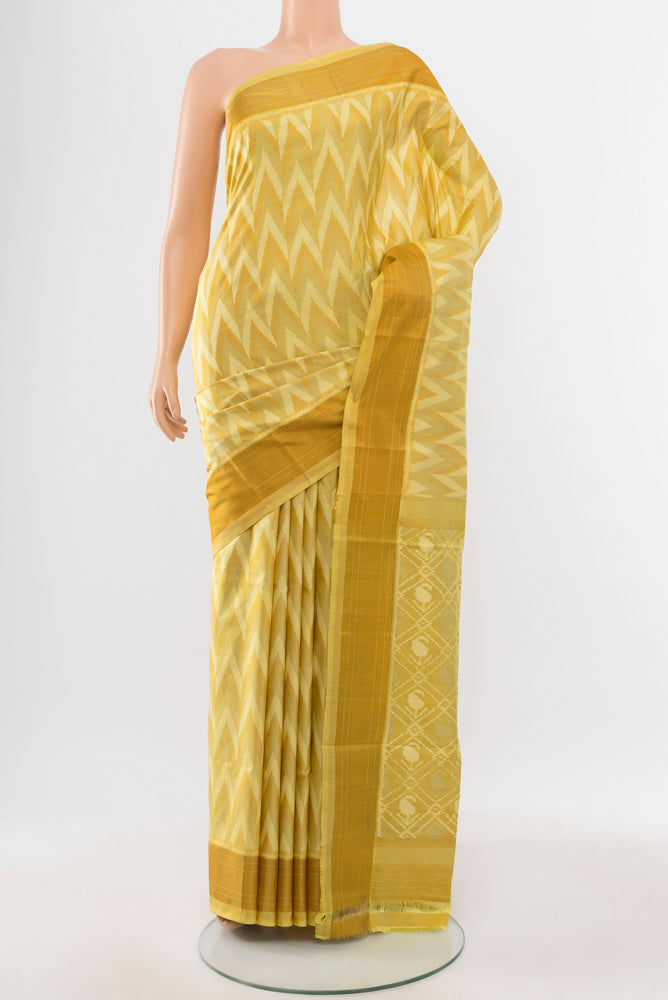 Lemon Yellow Pochampally Saree with Ikat Print on the body and Silk Border.  displayed on a mannequin