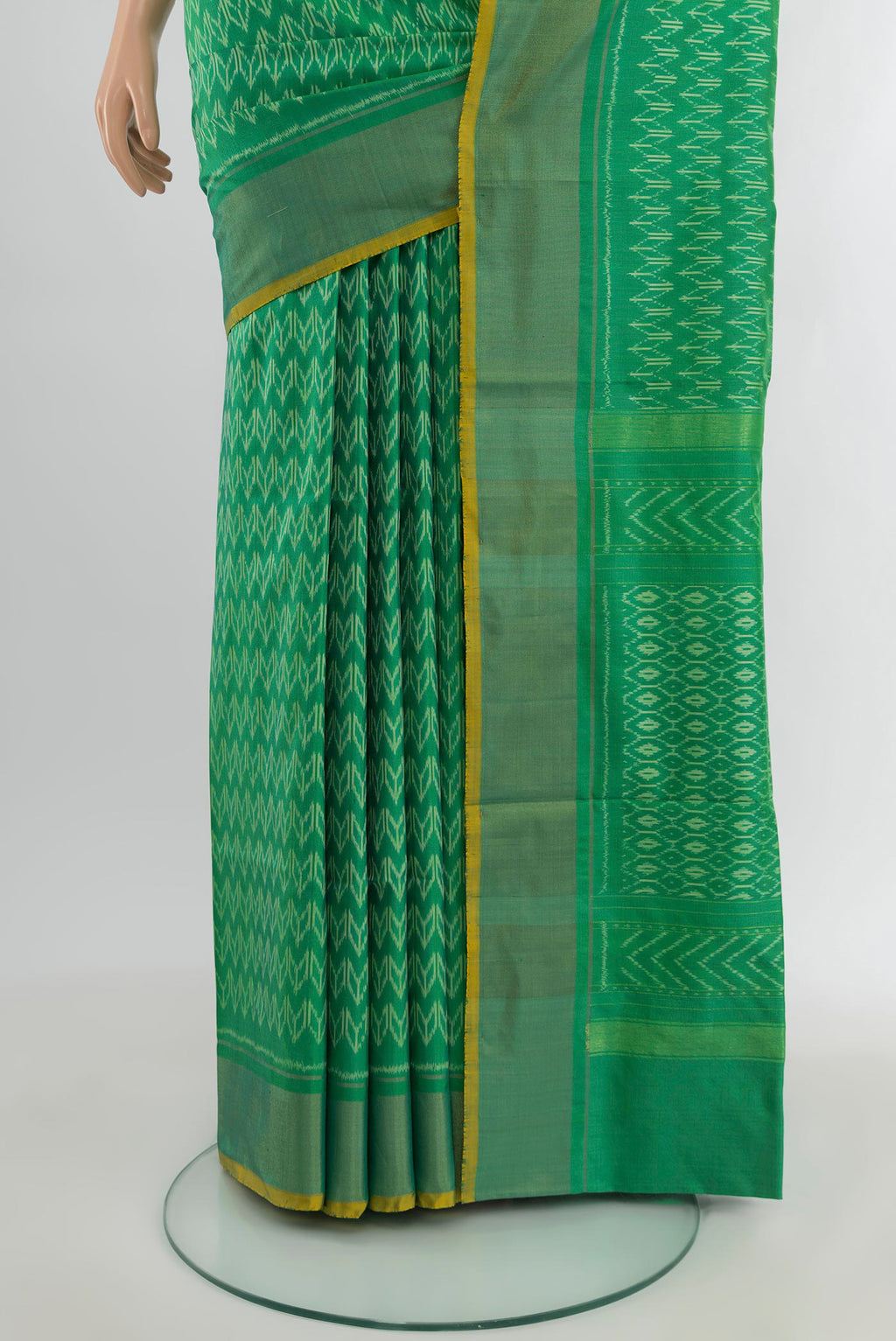 Pleats and pallu of Green Pochampally Silk Saree with Ikat design on the body and Zari Border. 