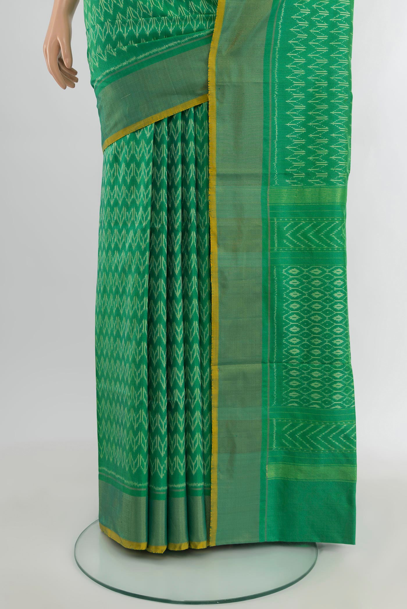 Pleats and pallu of Green Pochampally Silk Saree with Ikat design on the body and Zari Border. 