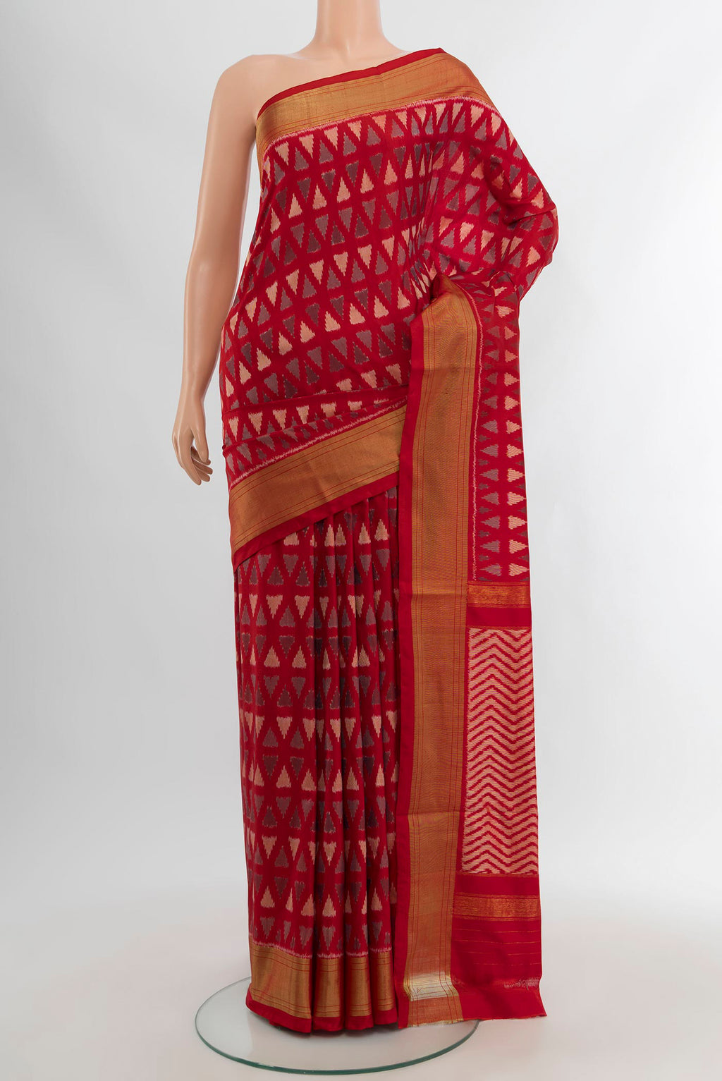Red Pochampally Silk Saree with Ikat design on the body and Zari Border.  displayed on a mannequin