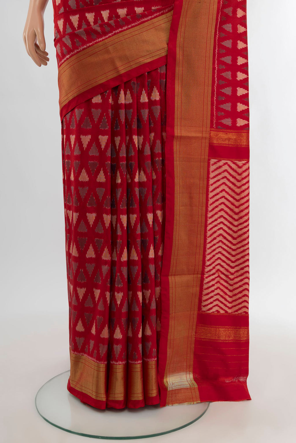 Pleats and pallu of Red Pochampally Silk Saree with Ikat design on the body and Zari Border. 