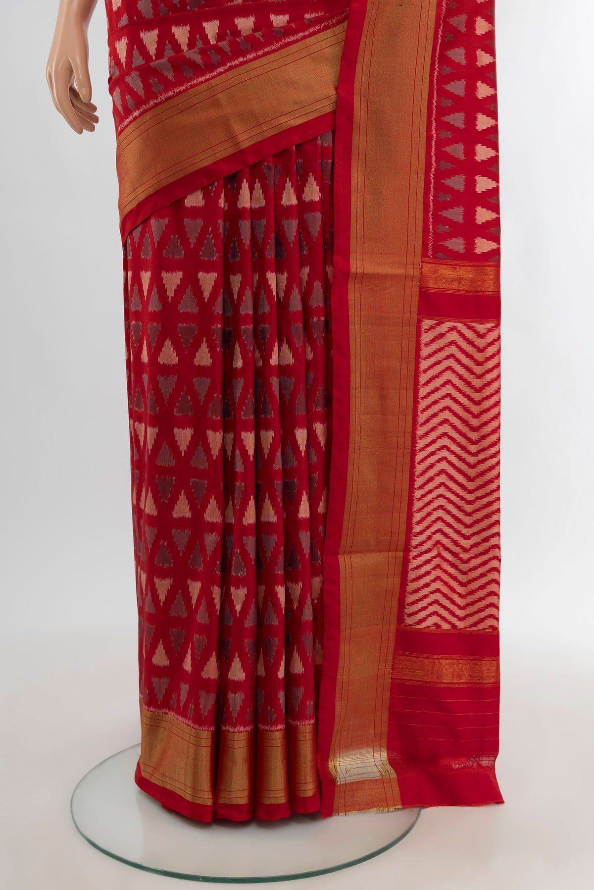 Pleats and pallu of Red Pochampally Silk Saree with Ikat design on the body and Zari Border. 
