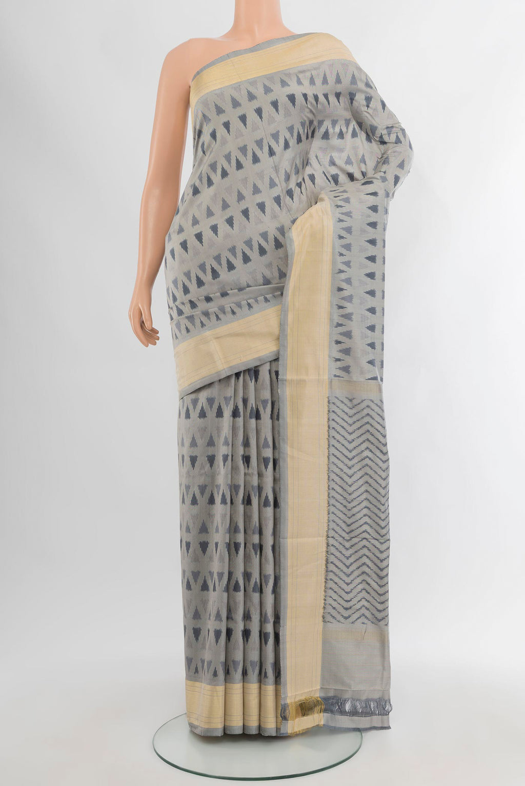 Davys Grey Pochampally Silk Saree with Ikat design on the body and Zari Border.  displayed on a mannequin