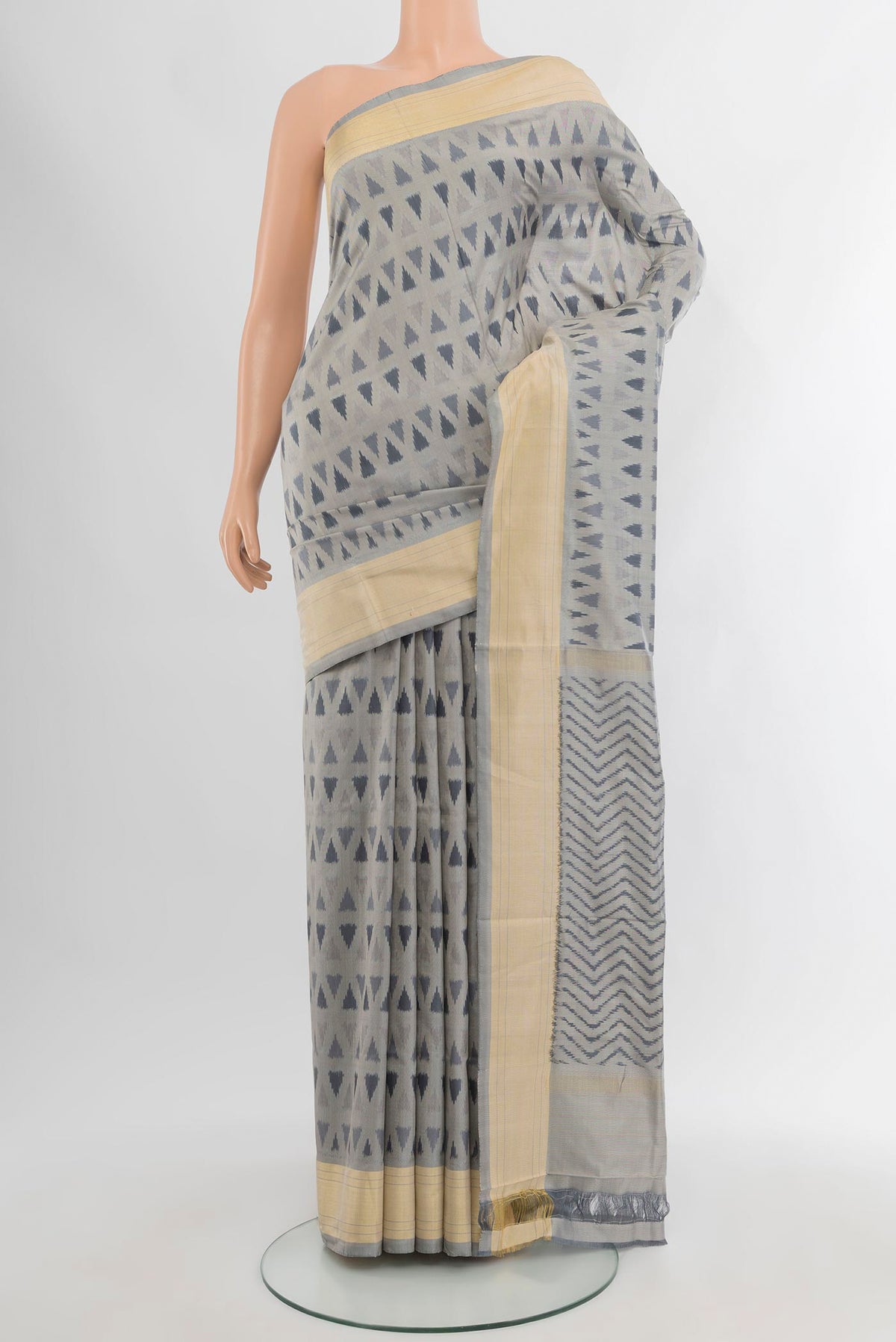 Davys Grey Pochampally Silk Saree with Ikat design on the body and Zari Border.  displayed on a mannequin