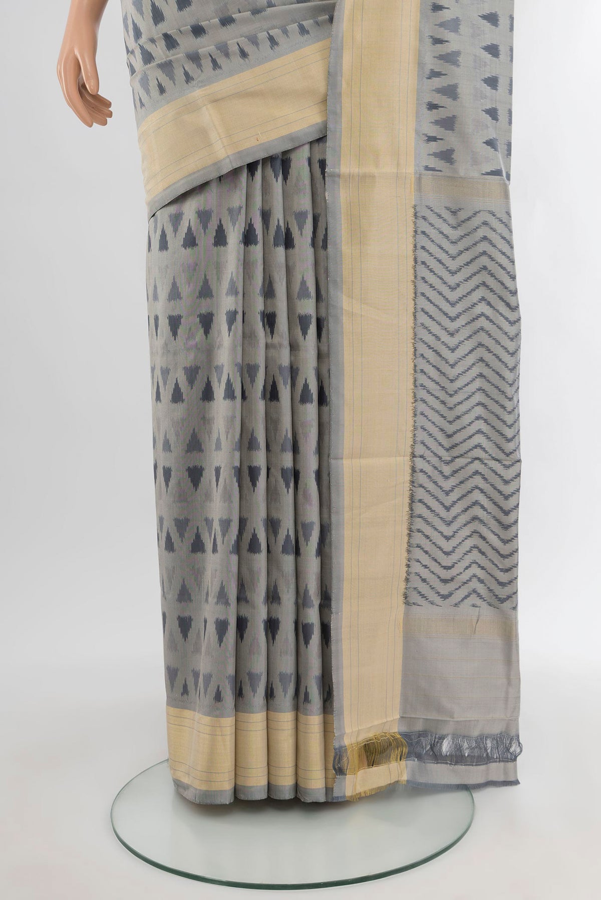 Pleats and pallu of Davys Grey Pochampally Silk Saree with Ikat design on the body and Zari Border. 