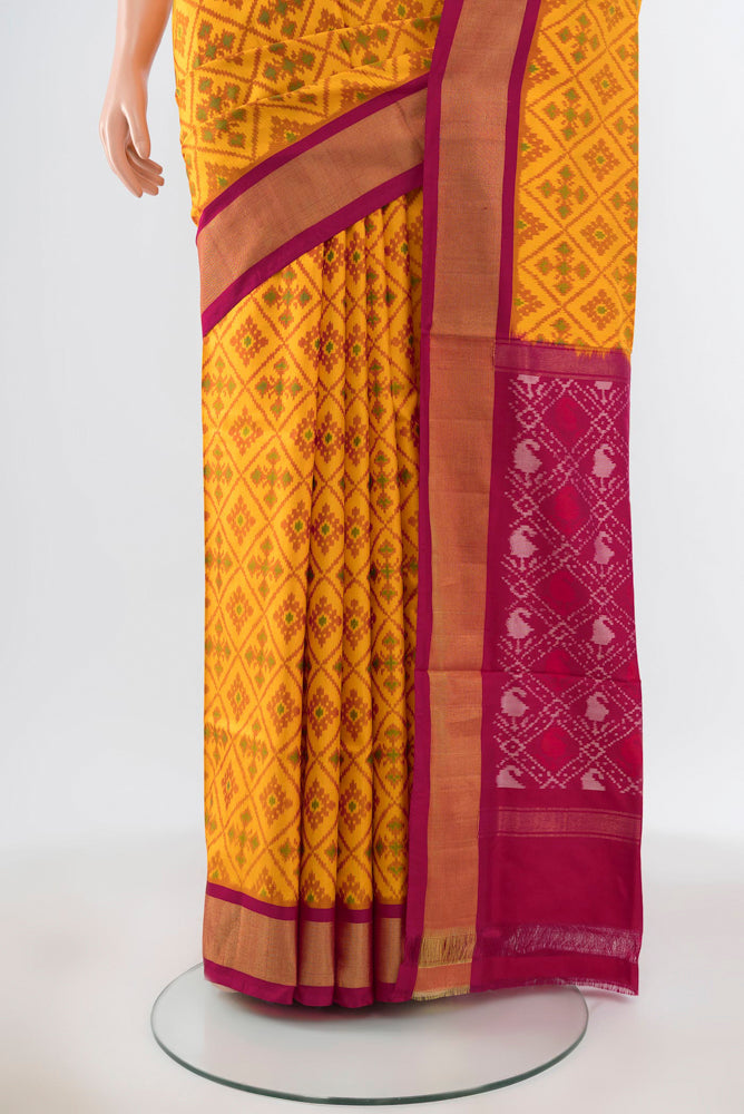 Pleats and pallu of Pure Silk Pure Zari Yellow Pochampally Saree with Ikat Print on the body and Silk Border. 