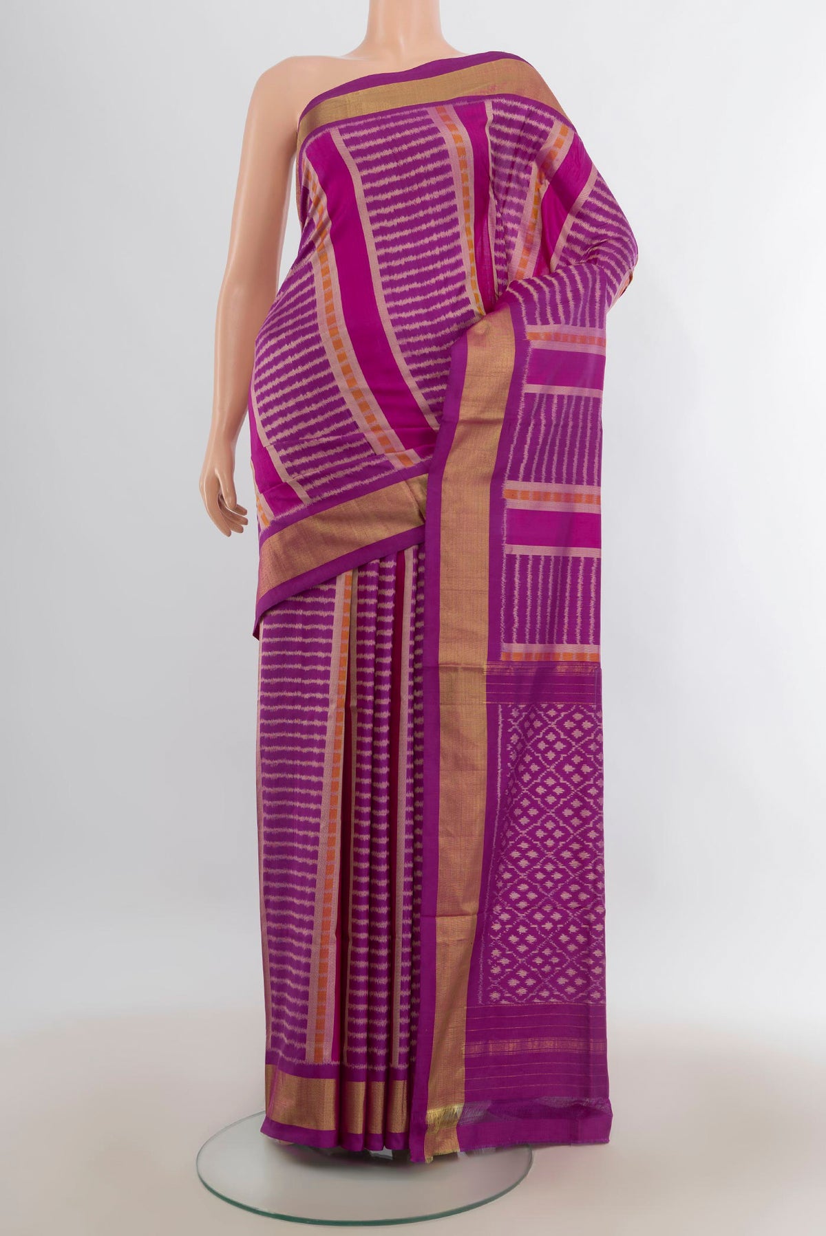 Pure Silk Magenta Pochampally Saree with Pure Ikat on the body and Zari Border.  displayed on a mannequin