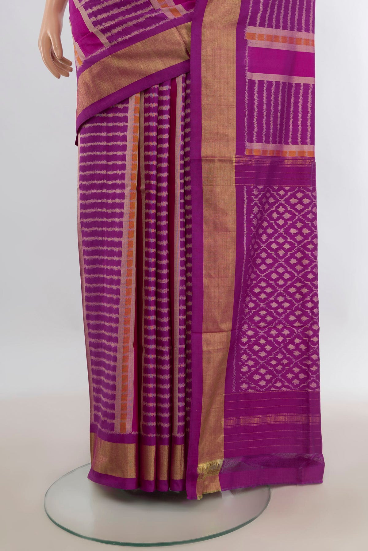 Pleats and pallu of Pure Silk Magenta Pochampally Saree with Pure Ikat on the body and Zari Border. 