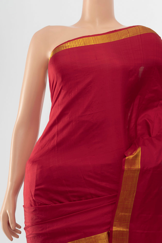 Border image of Pure Silk Pure Zari Maroon Kanjivaram Saree with Zari Butta on the body and Silk Border. 