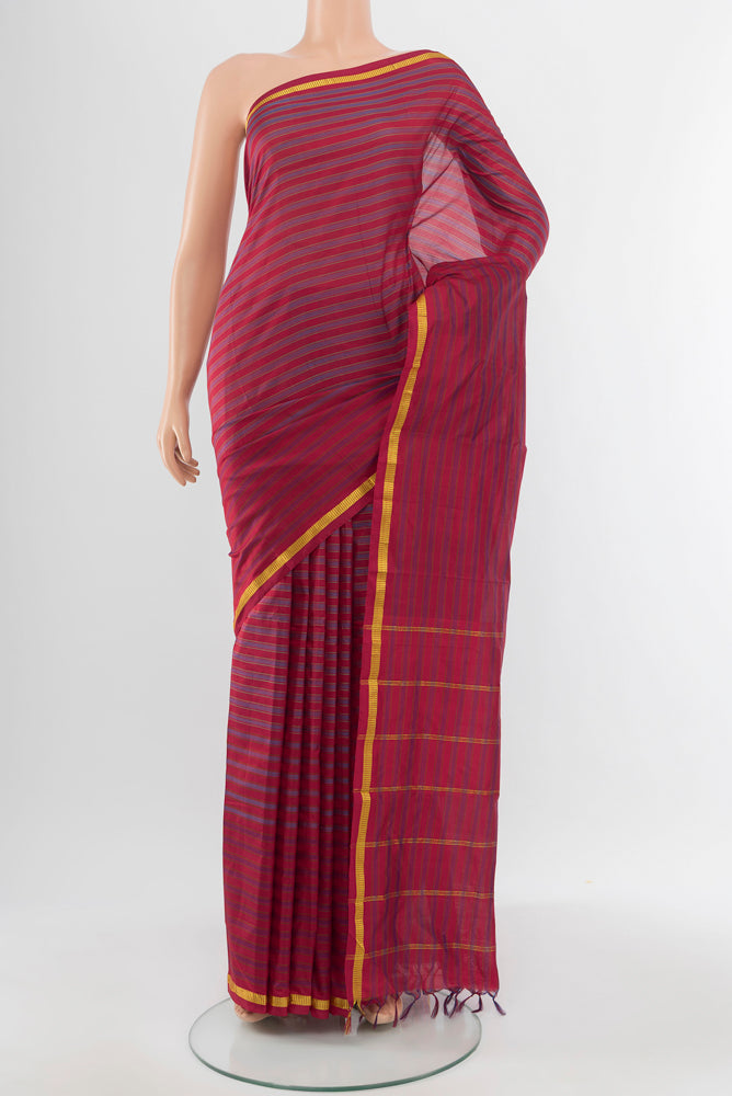 Multi Color Kanchipuram Silk Saree with Zari Butta on the body and Silk Border.  displayed on a mannequin