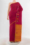 Pure Silk Pure Zari Maroon Kanchipuram Saree with Zari Butta on the body and Silk Border.  displayed on a mannequin