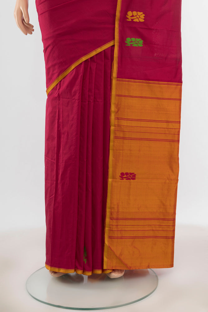 Pleats and pallu of Pure Silk Pure Zari Maroon Kanchipuram Saree with Zari Butta on the body and Silk Border. 