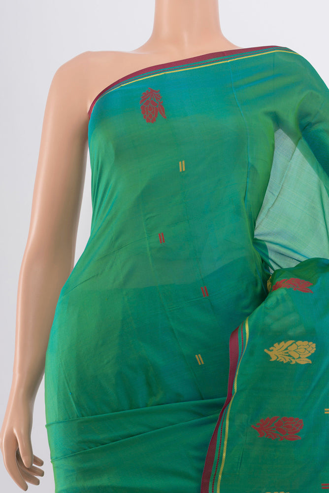 Border image of Peacock Blue Kanchipuram Silk Saree with Zari Butta on the body and Silk Border. 