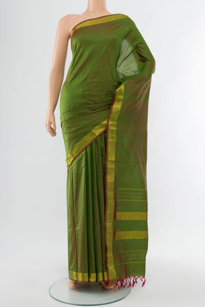 Mehandi Green Kanjivaram Silk Saree with Plain Body and Silk Border.  displayed on a mannequin