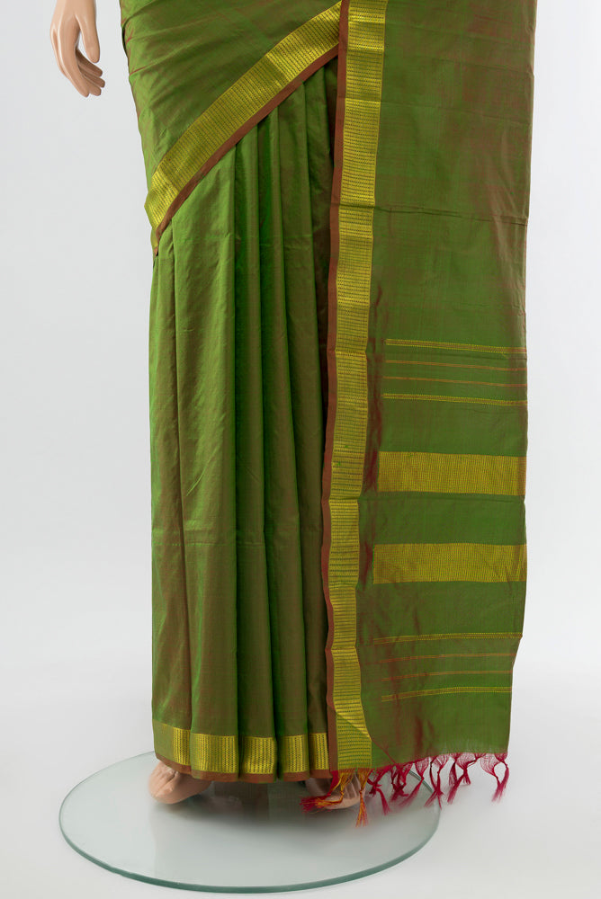 Pleats and pallu of Mehandi Green Kanjivaram Silk Saree with Plain Body and Silk Border. 