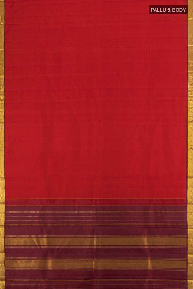 Flat view of Red Kanjivaram Silk Saree with Zari Butta on the body and Silk Border. 