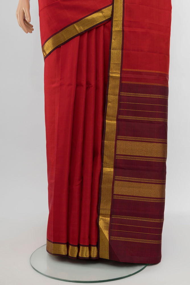 Pleats and pallu of Red Kanjivaram Silk Saree with Zari Butta on the body and Silk Border. 