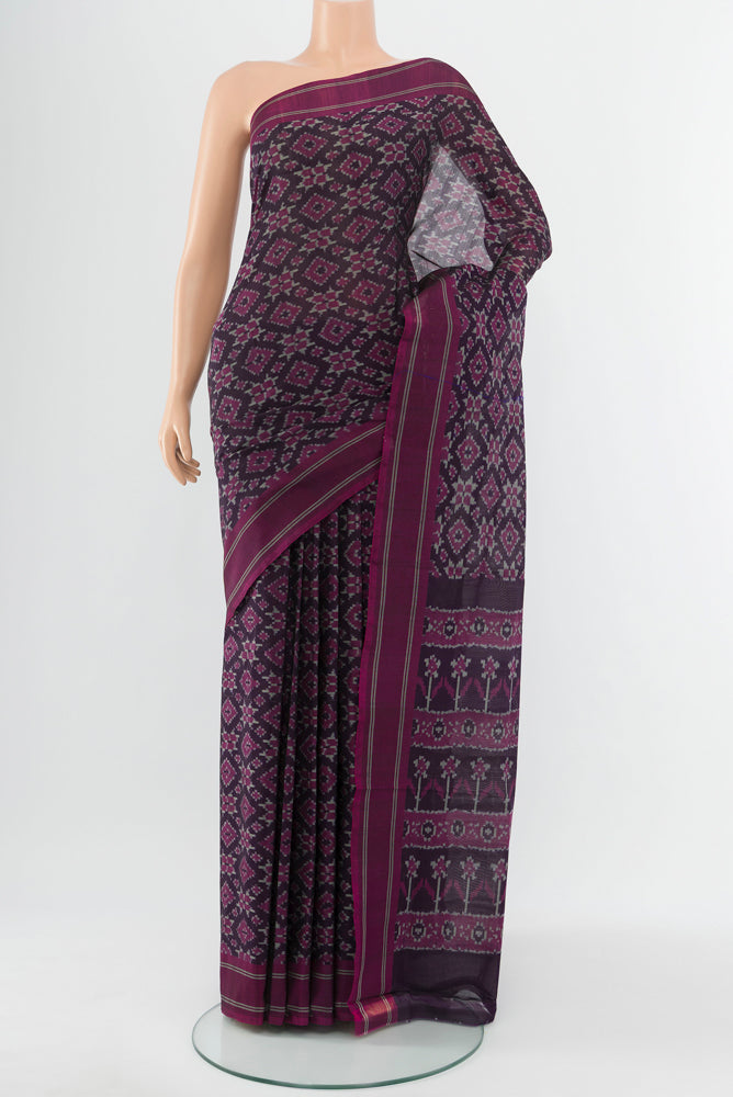Black Pochampally Saree with Ikat Print on the body and Silk Border.  displayed on a mannequin