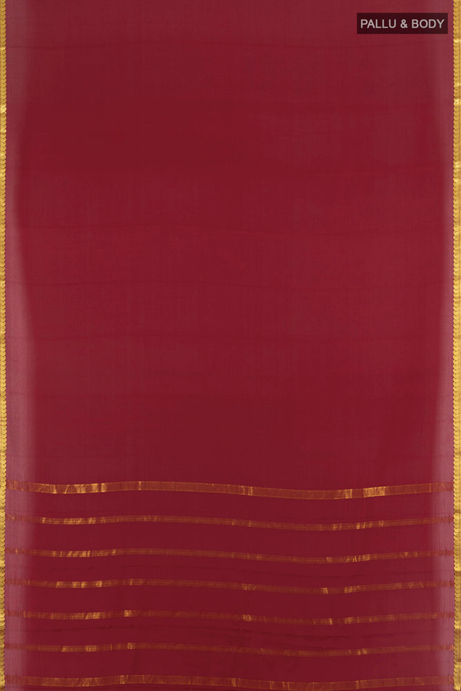 Flat view of Maroon Mysore Crepe Saree with Zari Butta on the body and Silk Border. 